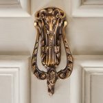 rams head door knocker aged brass