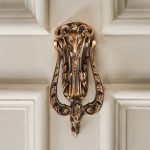 rams head door knocker aged brass