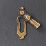 lady escutcheon aged brass