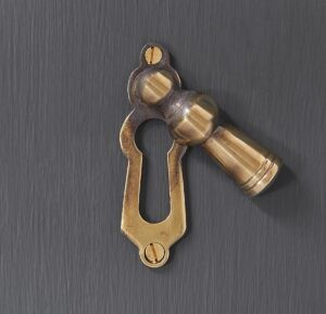 lady escutcheon aged brass