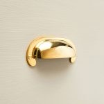 curved hooded drawer pull brass