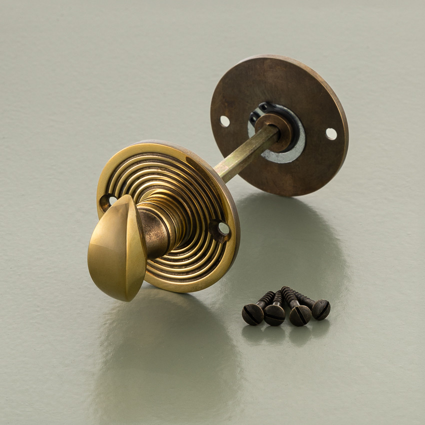 round bathroom turn and release aged brass