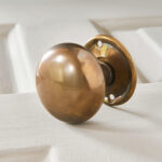 cottage bun door knobs (pair) antique brass