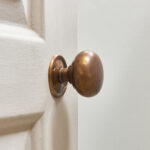 cottage bun door knobs (pair) antique brass
