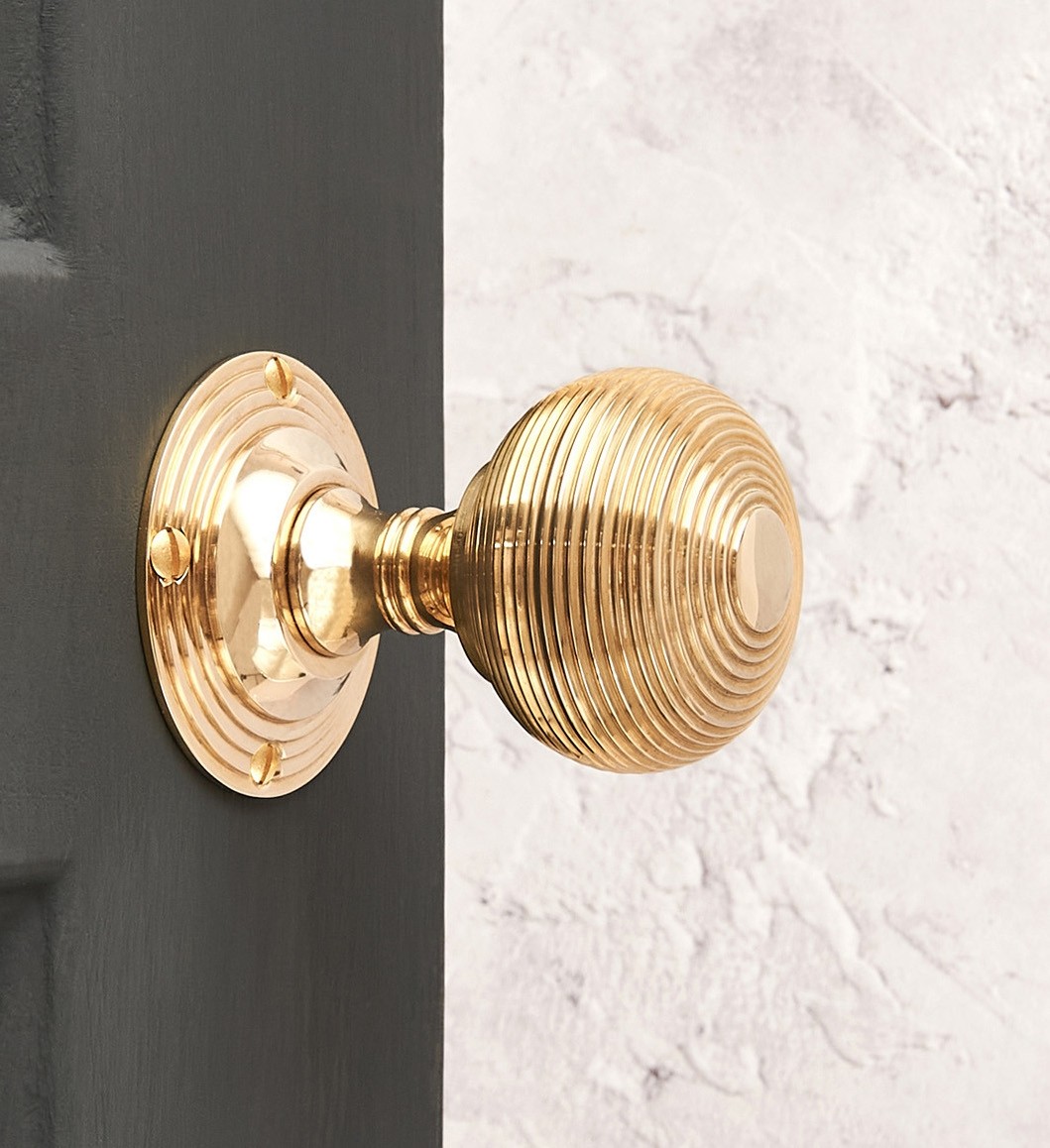 beehive-empire-door-knobs-pair-brass