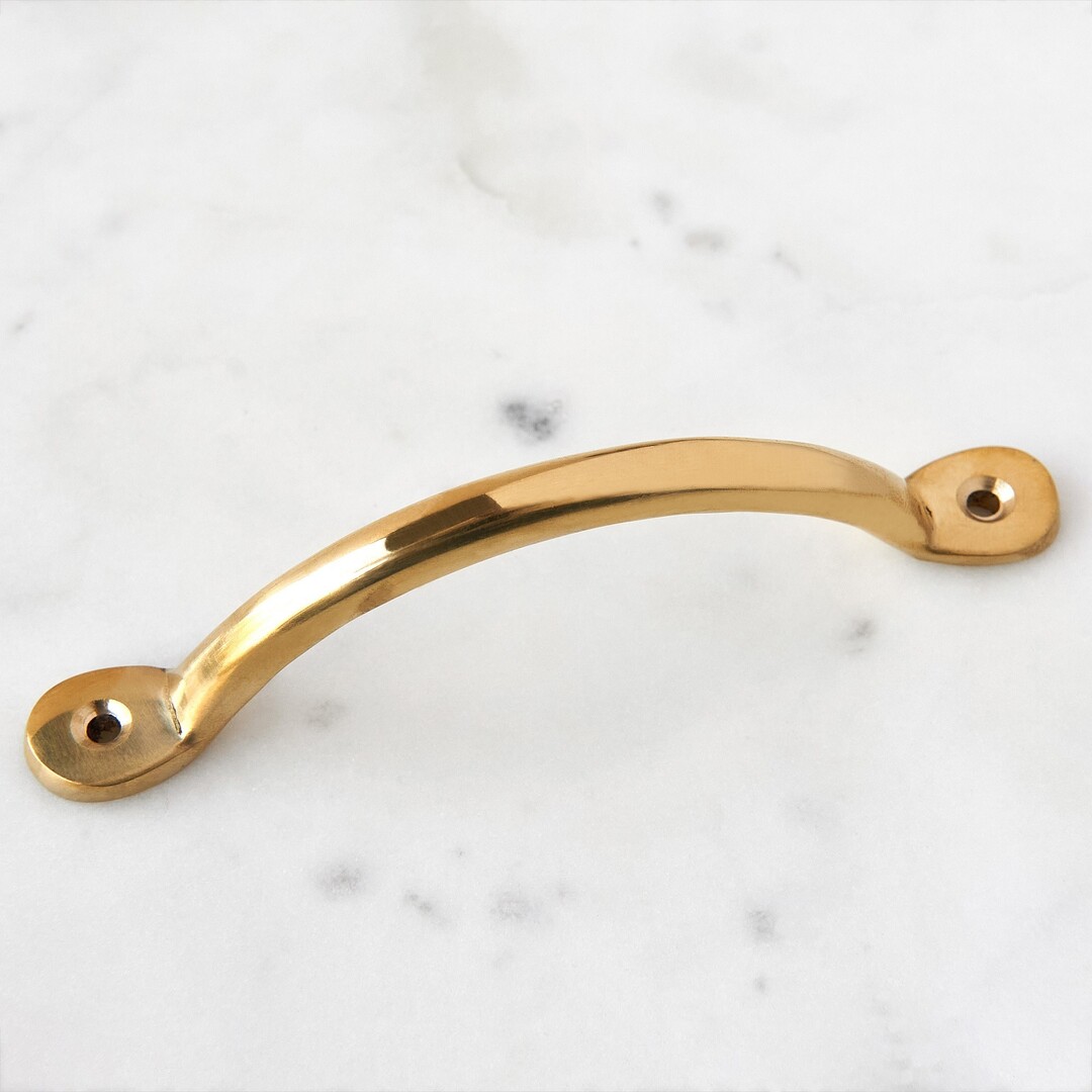 https://www.graceandgloryhome.co.uk/wp-content/uploads/2022/10/bow-handle-brass1.jpg