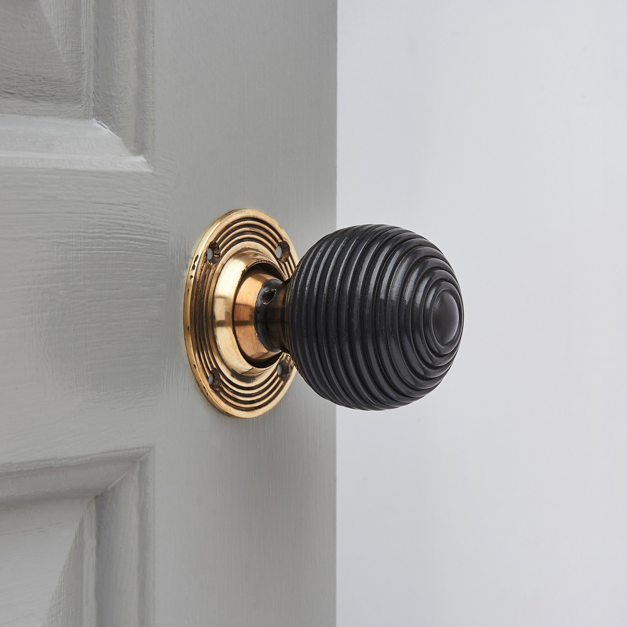 Ebony Wood Beehive Door Knobs with an Aged Brass Collar & Rose