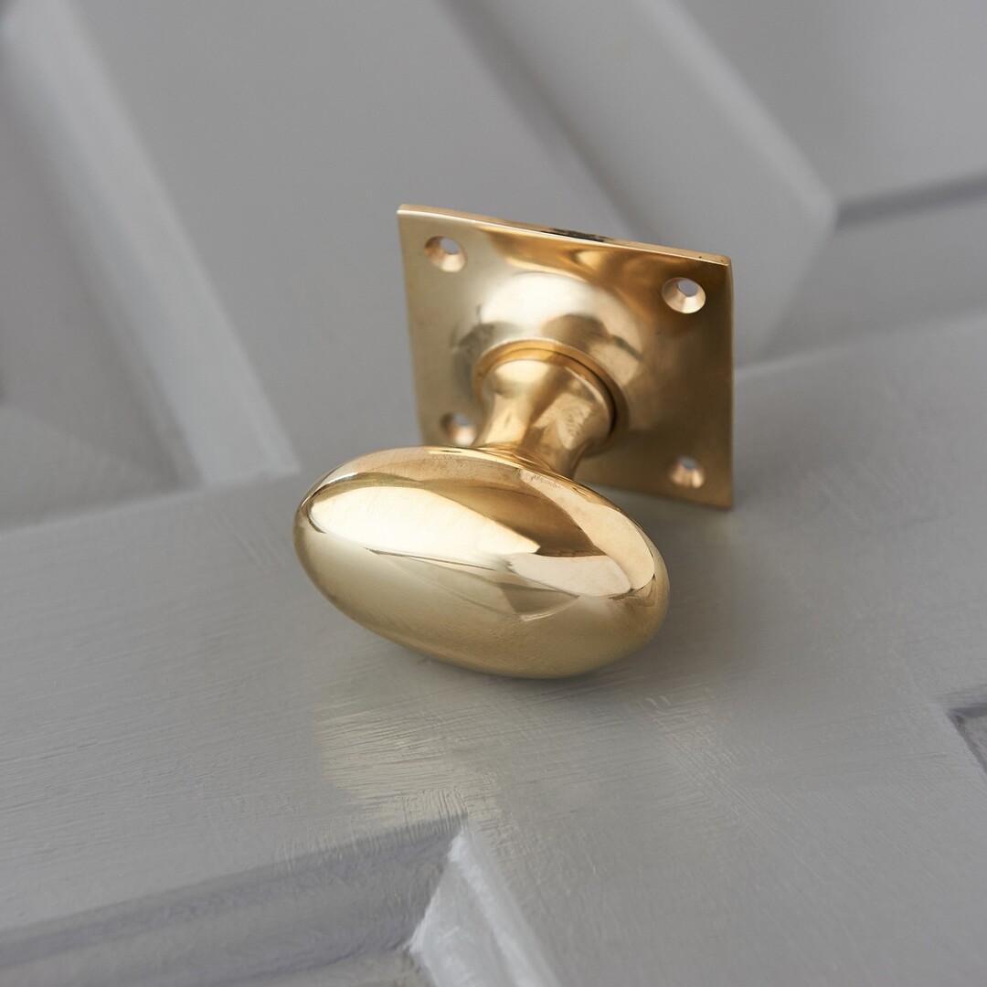 Oval Door Knobs on Square Back Plate (Pair) - Polished Brass