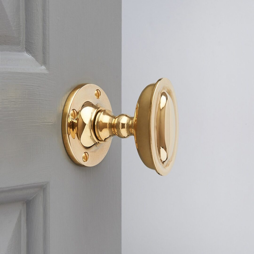 Raised Oval Door Knobs Polished Brass