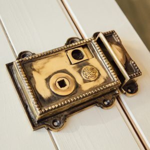 Beaded Regency-Style Rim Latch - Aged Brass