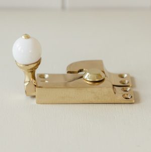 Straight Arm Sash Window Fastener with White Knob - Brass