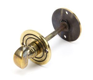 Round Bathroom Turn And Release - Aged Brass