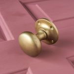 cushion door knobs (pair) aged brass