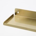ledged brass shelf