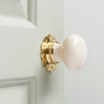 cream porcelain door knobs (pair) polished brass collar & rose