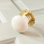 cream porcelain door knobs (pair) polished brass collar & rose