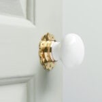 white porcelain door knobs (pair) polished brass collar & rose