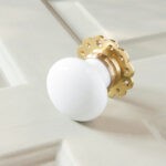 white porcelain door knobs (pair) polished brass collar & rose
