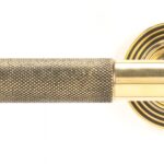 aged brass brompton lever on rose set (beehive)