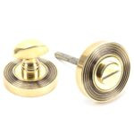 aged brass round thumbturn set (beehive)