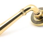 aged brass newbury lever on rose set (beehive)