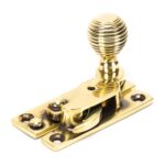 aged brass beehive sash hook fastener