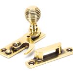 aged brass beehive sash hook fastener