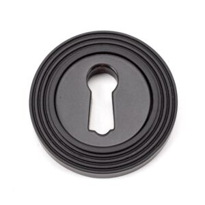 aged bronze round escutcheon (beehive)