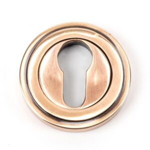 polished bronze round euro escutcheon (art deco)