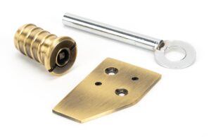 aged brass key flush sash stop