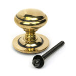aged brass round centre door knob