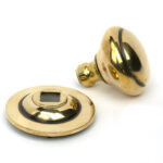 aged brass round centre door knob
