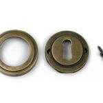 burnished brass round escutcheon (art deco)