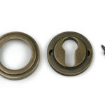 burnished brass round euro escutcheon (art deco)