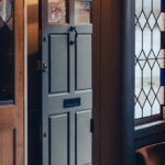 aged bronze small letter plate