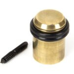 aged brass floor mounted door stop