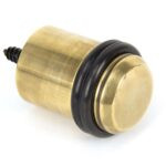 aged brass floor mounted door stop