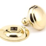 polished brass round centre door knob