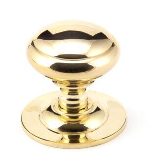 polished brass round centre door knob
