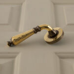 classic hammered lever handles (pair) aged brass