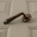 classic hammered lever handles (pair) antique brass