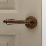 classic hammered lever handles (pair) antique brass